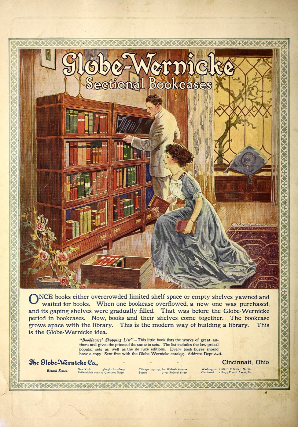 A 1913 magazine advert: a couple adding books to a sectional bookcase built from stacked glass-fronted sections.